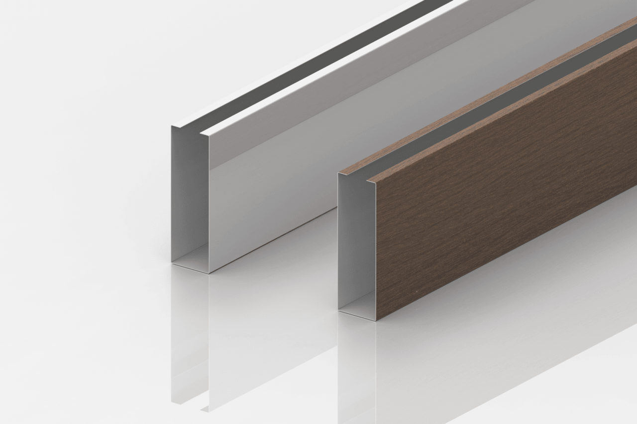 Two metal U-shaped channels stand upright on a white reflective surface. The left channel is silver, while the right channel has a brown wood-like finish. Both are positioned parallel to each other.